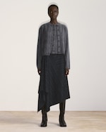 Placeholder for: woman in grey layered cardigan