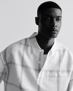 Placeholder for: man in grid print shirt