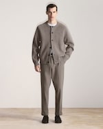 Placeholder for: man in brown cardigan