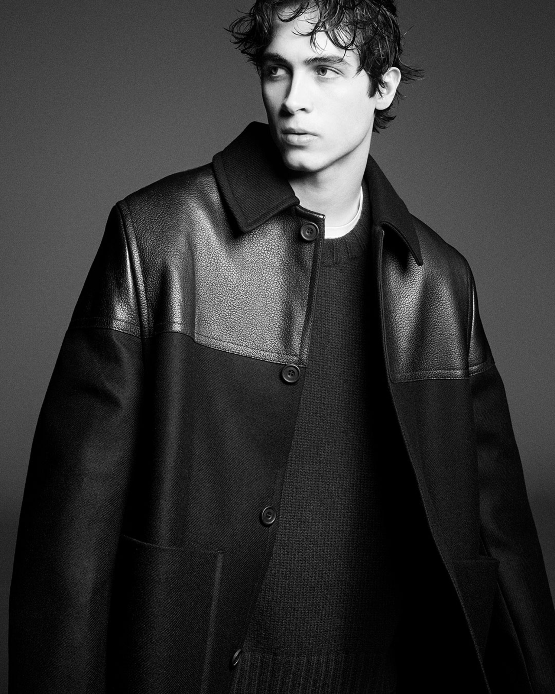 man in contrast leather jacket