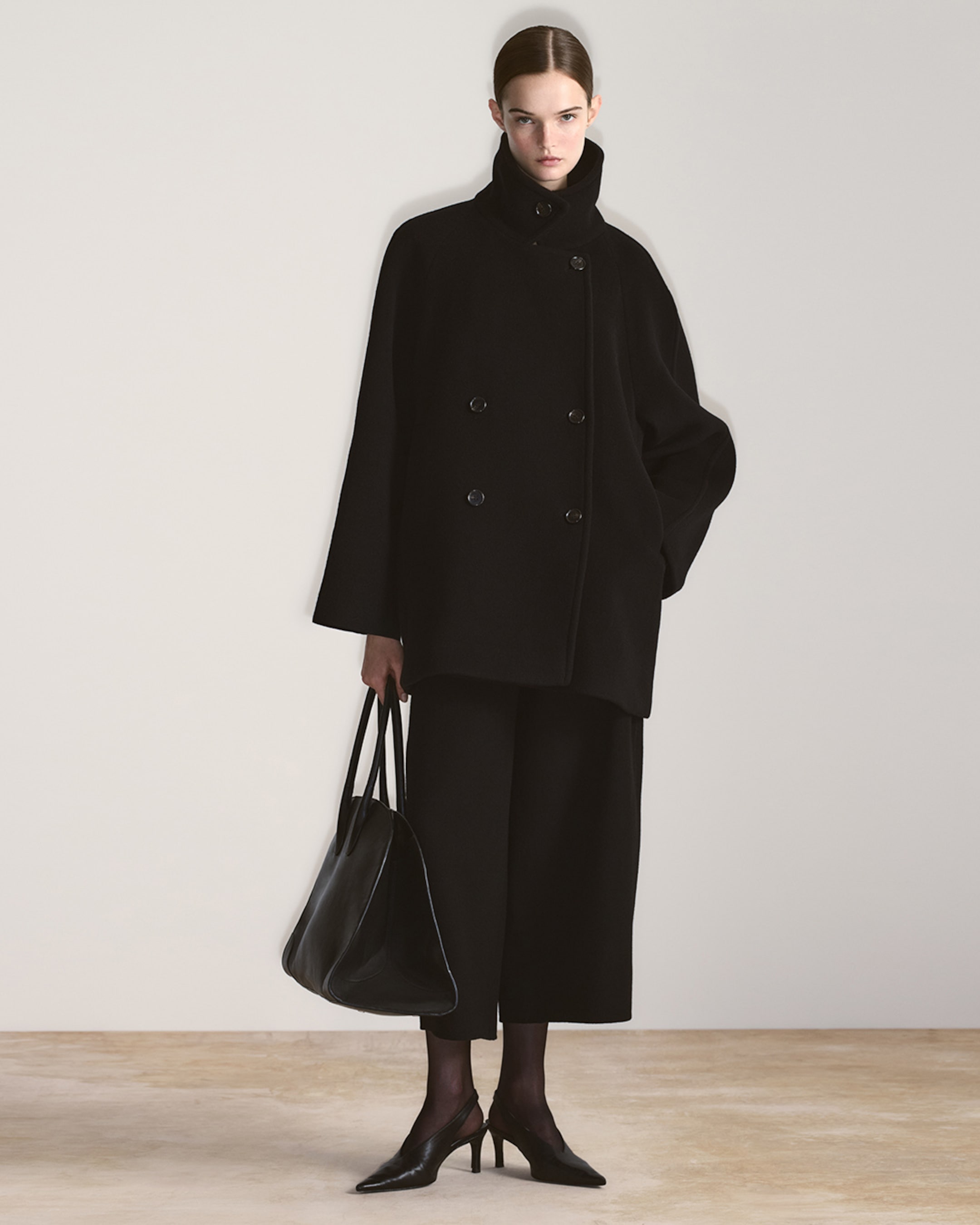 woman in double breasted coat