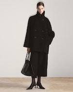 Placeholder for: woman in double breasted coat