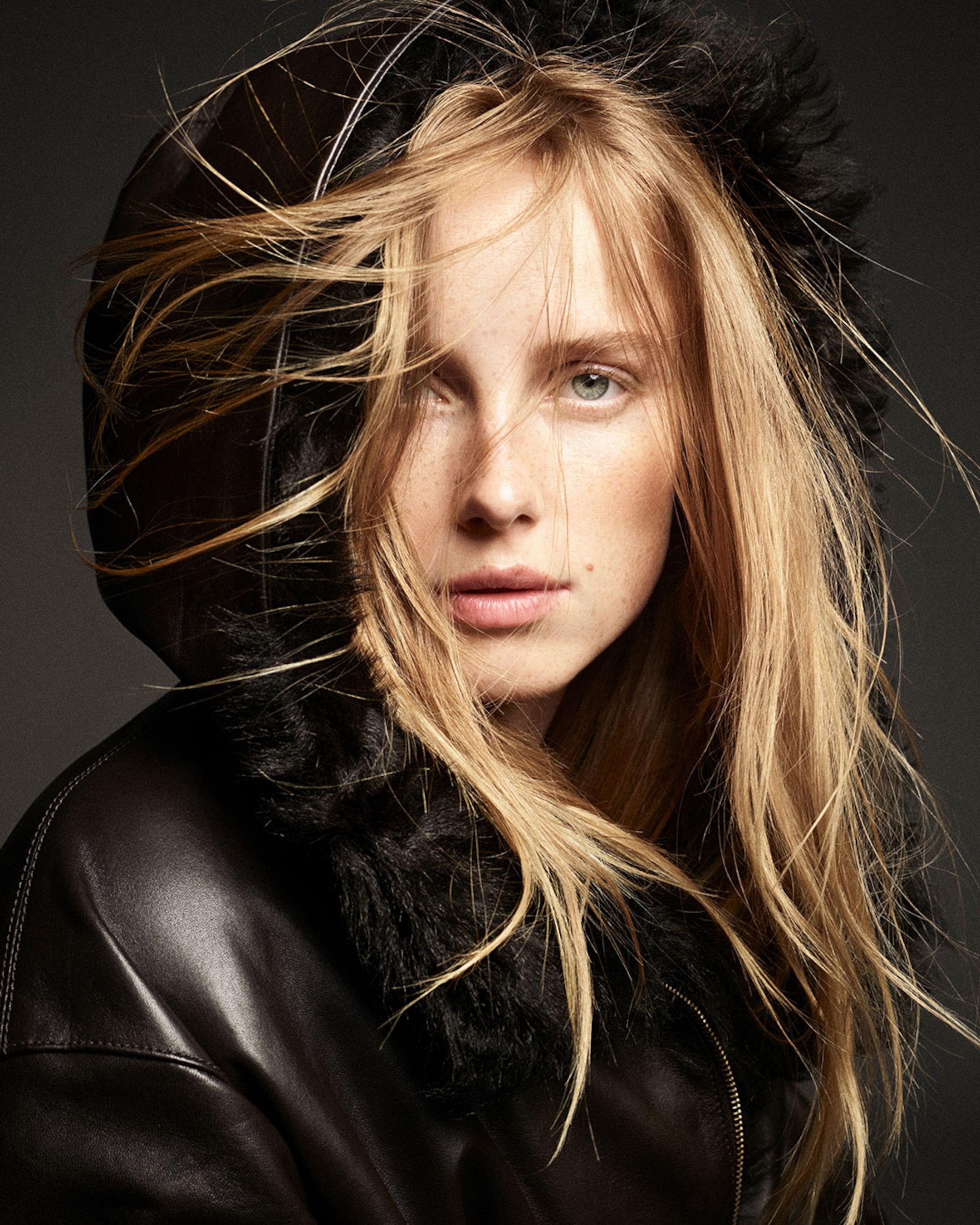 Woman with leather hoodie