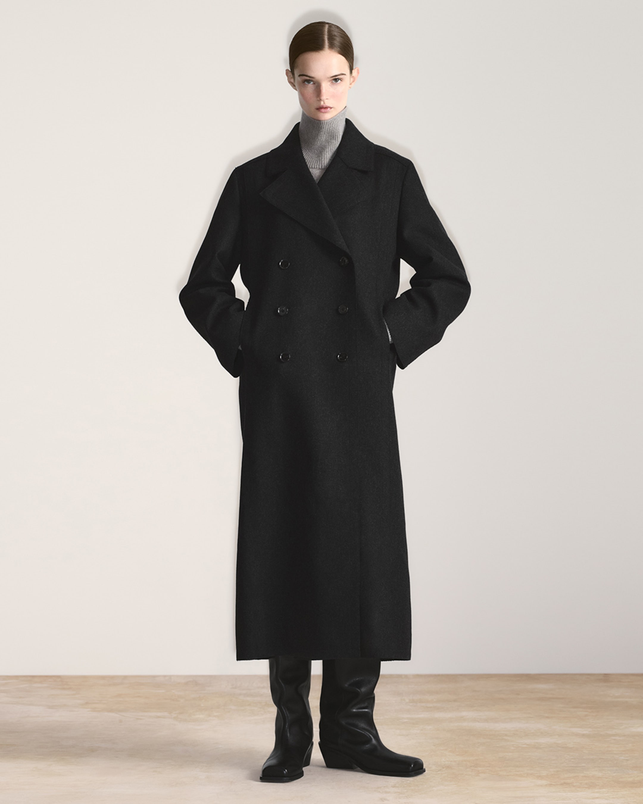 woman in long double breasted coat