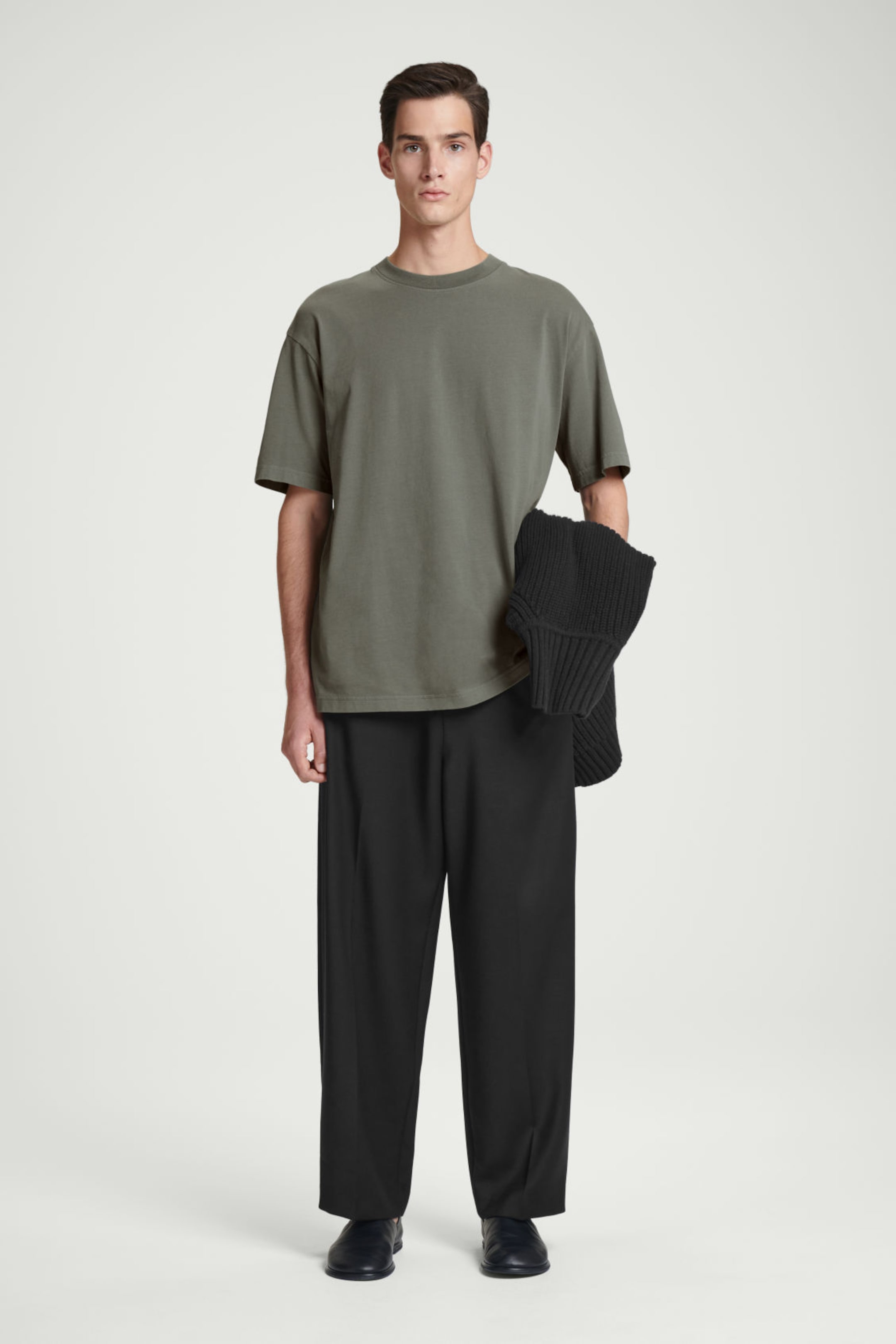 Man in oversized green top