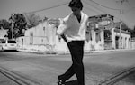 Placeholder for: man in white linen short sleeve shirt and black pant