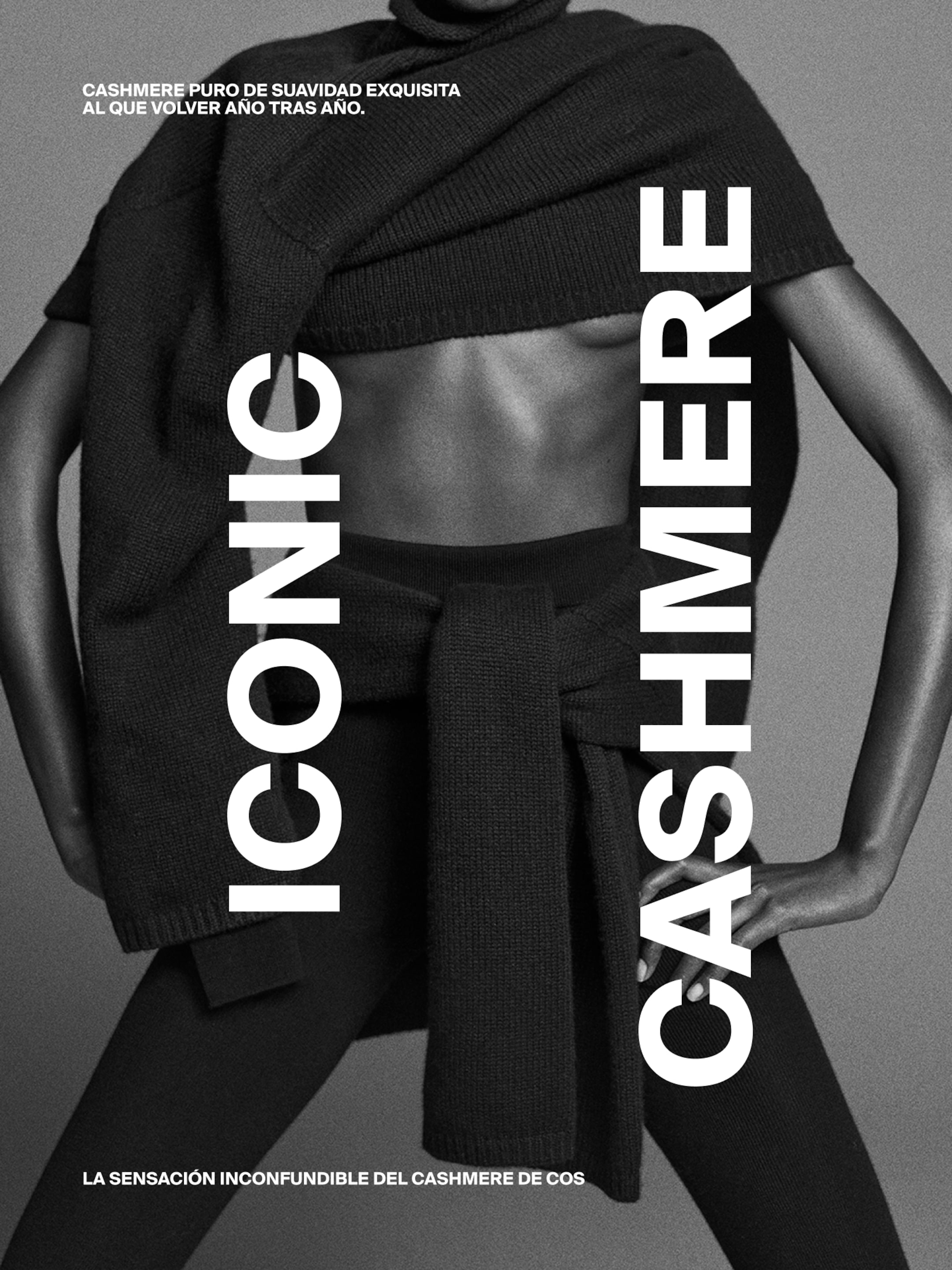 Model in a dark cashmere outfit with bold text "Iconic Cashmere" and Spanish text promoting exquisite softness.