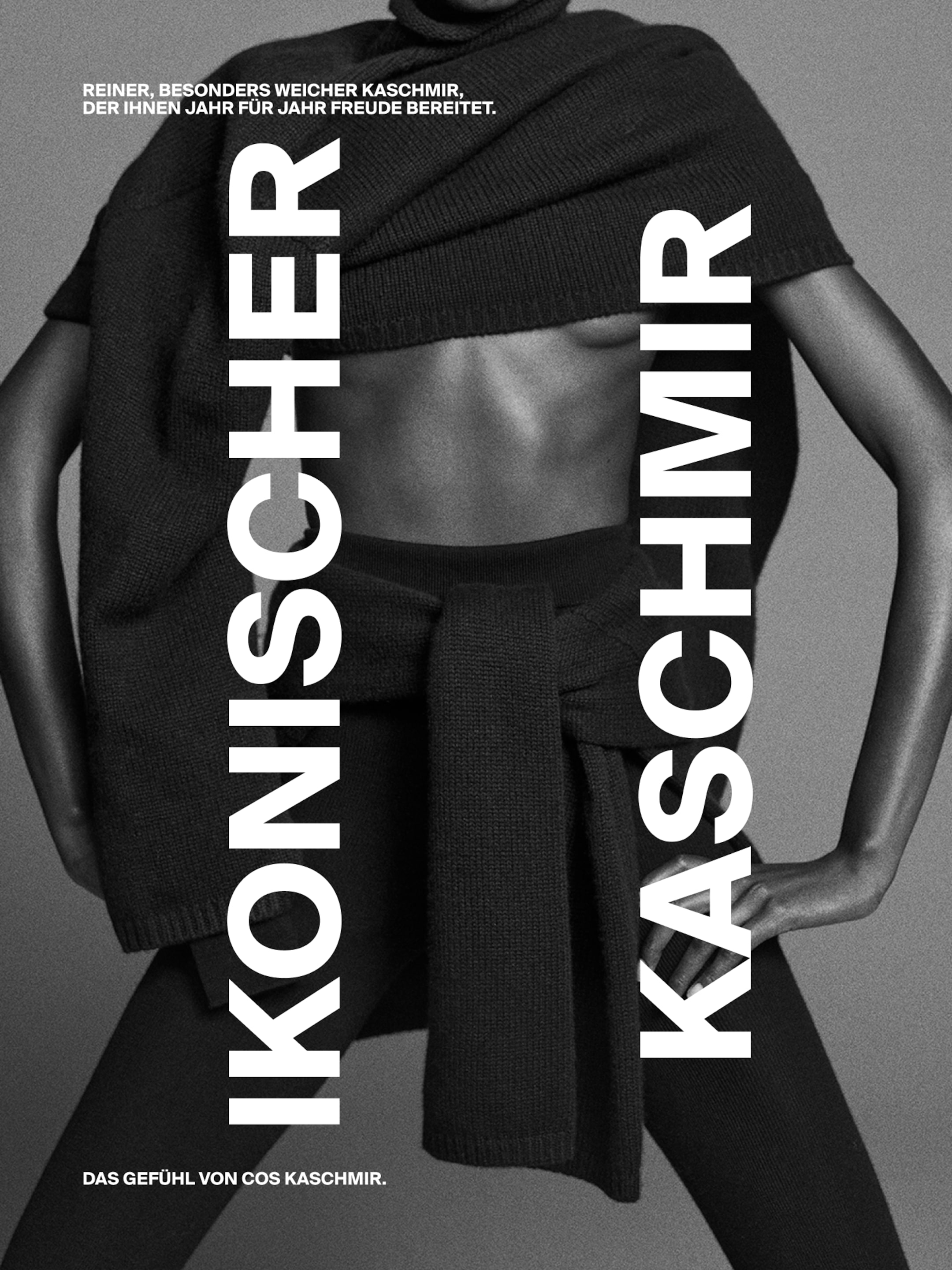 Monochrome fashion ad featuring a person wearing layered cashmere clothing with bold German text promoting softness and joy.