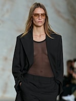 Placeholder for: woman in sheer top and blazer