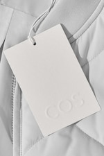 Placeholder for: COS clothing tag