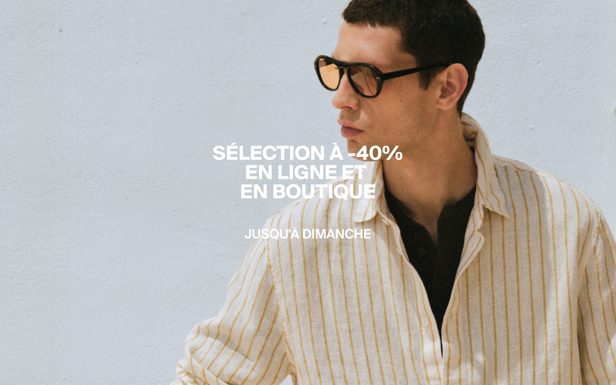 Man in sunglasses wearing a striped shirt against a white background with text about a 40% discount offer online and in-store until Sunday.