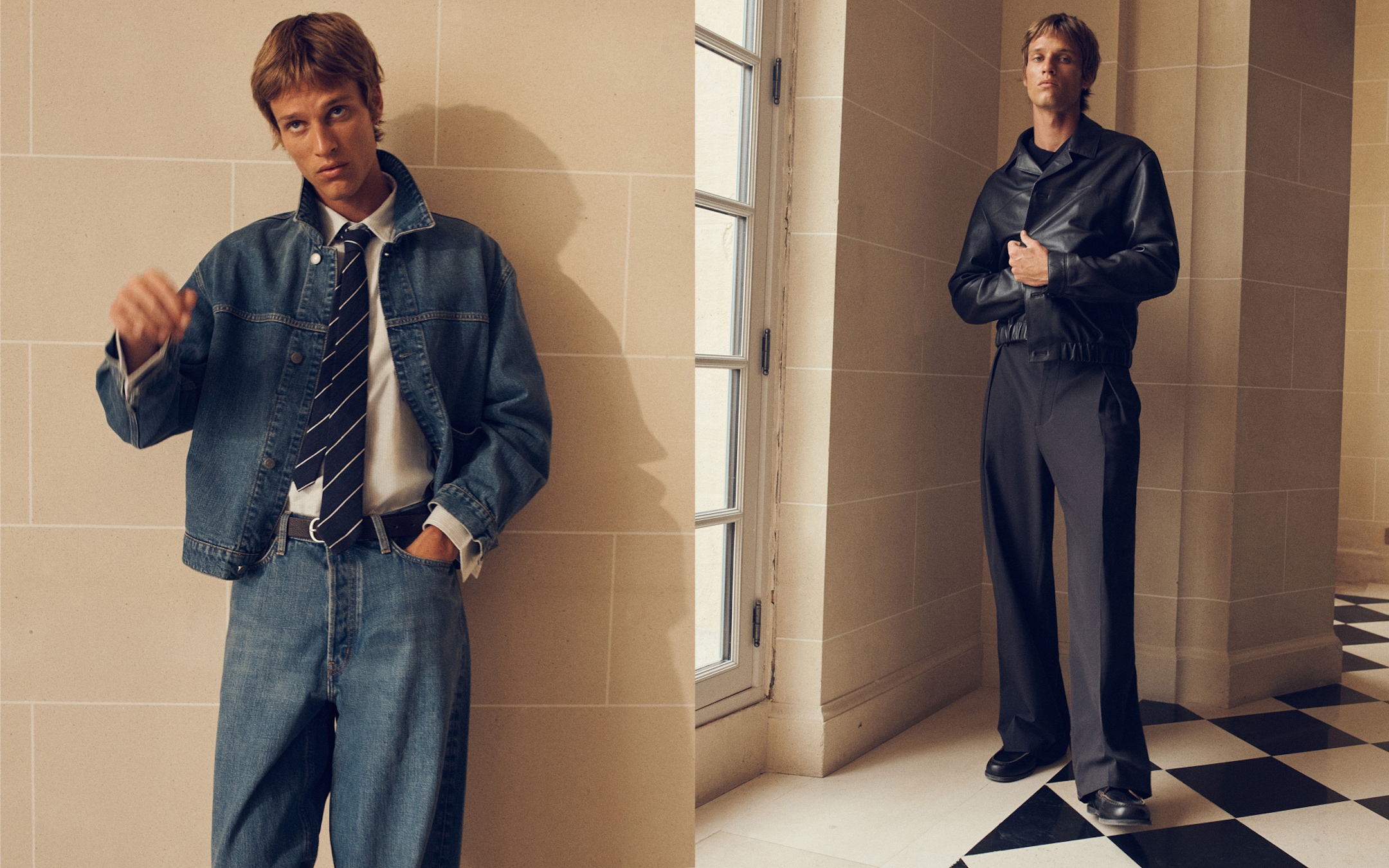 Two men in fashion outfits: one in a denim jacket, jeans, and a tie; the other in a black leather jacket and dark trousers, both against a tiled wall.