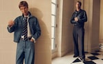 Placeholder for: Two men in fashion outfits: one in a denim jacket, jeans, and a tie; the other in a black leather jacket and dark trousers, both against a tiled wall.
