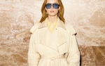 Placeholder for: person wearing beige coat