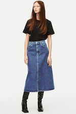 Placeholder for: Woman wearing black tshirt with midi denim skirt