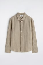 Placeholder for: Beige long-sleeve, button-up shirt with subtle vertical stripes, displayed on a white background.
