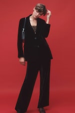 Placeholder for: Woman wearing matching black velvet suit