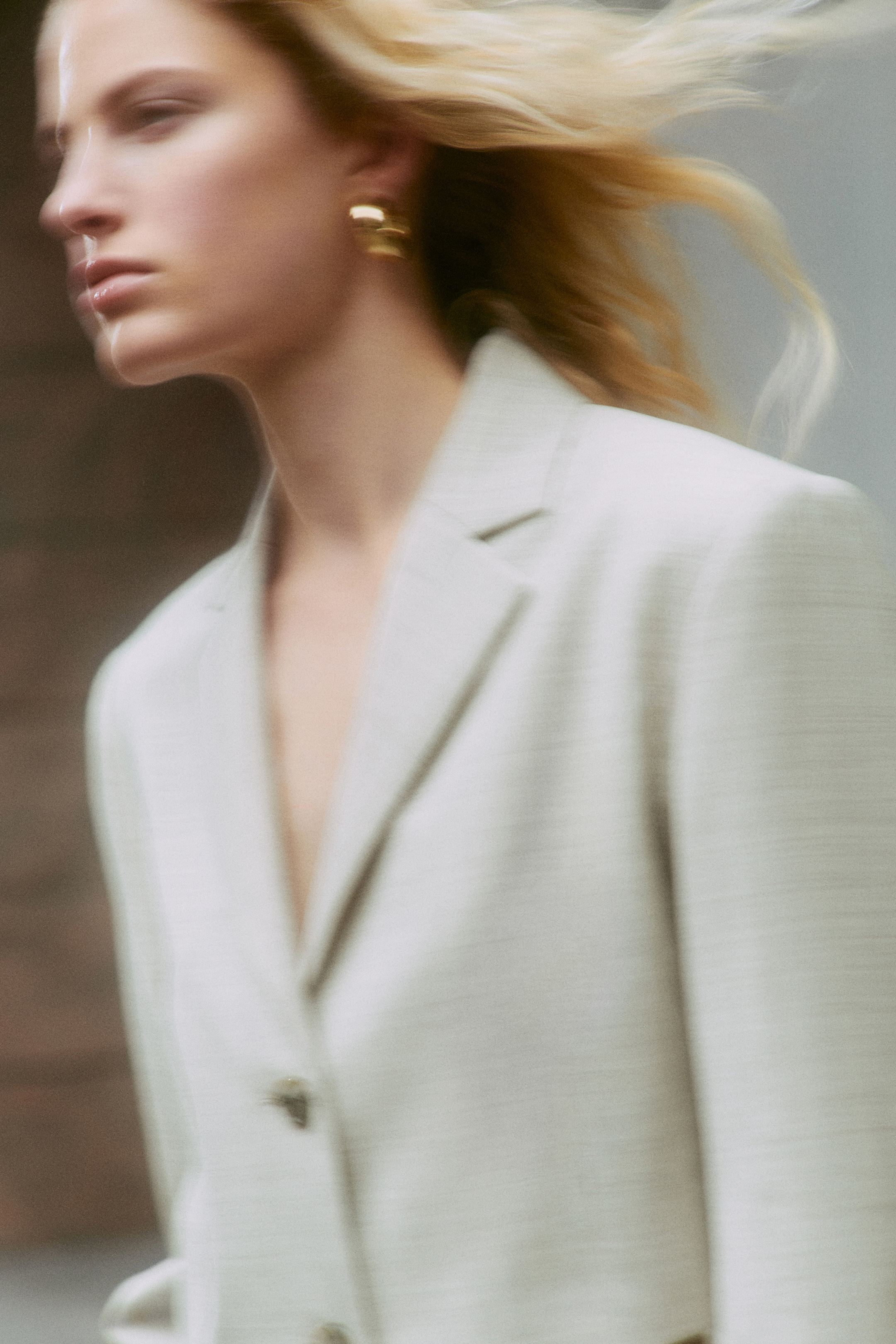 Person wearing beige suit jacket