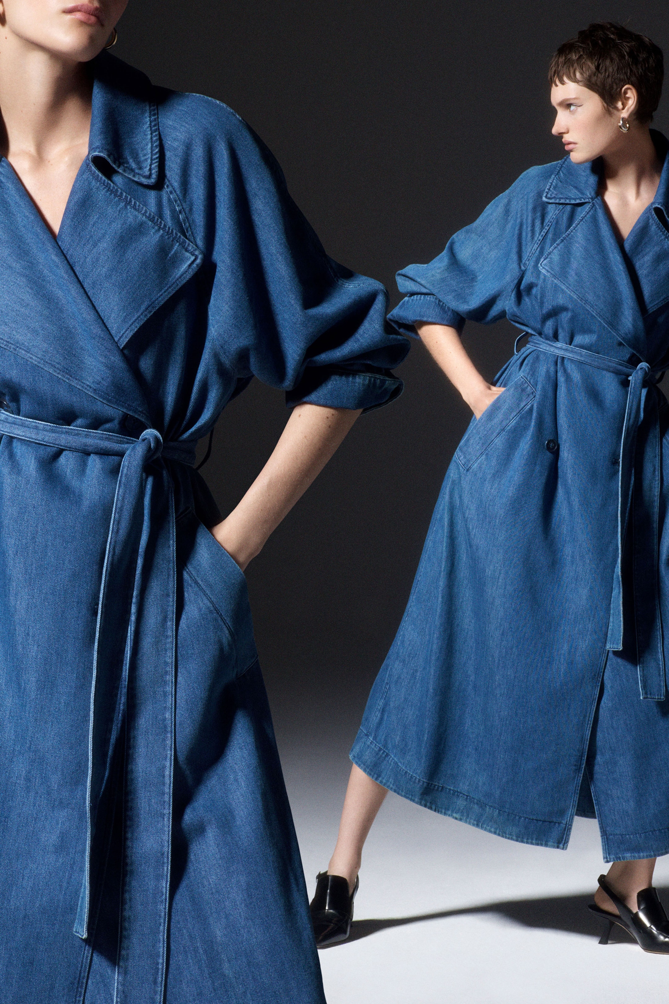 Woman wearing long blue denim coat