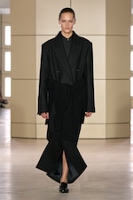 Placeholder for: Person walking on a runway wearing black