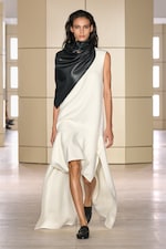 Placeholder for: Person walking on a runway wearing white