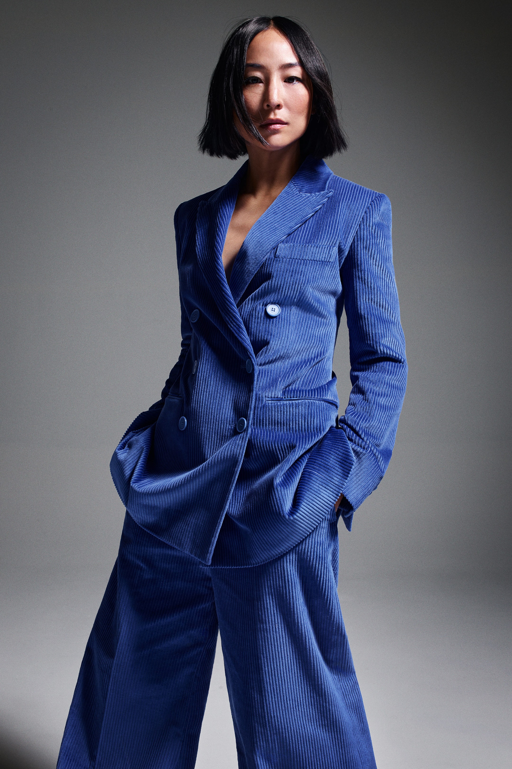 Greta Lee wears suit by COS