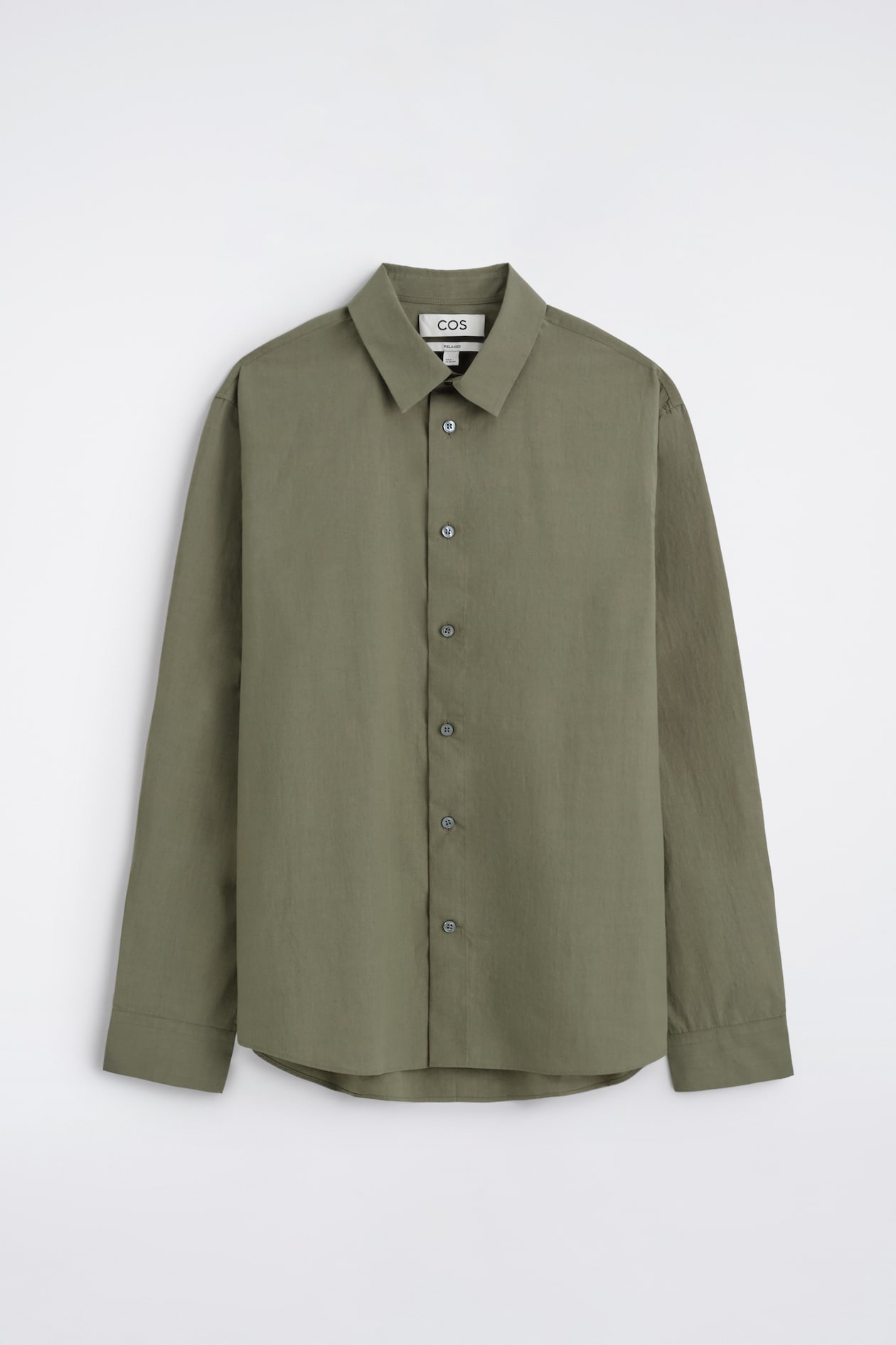 Olive green button-up shirt with collar and long sleeves, hanging against a plain white background.