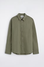 Placeholder for: Olive green button-up shirt with collar and long sleeves, hanging against a plain white background.