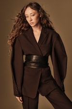 Placeholder for: Person wearing brown blazer