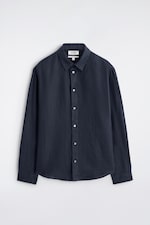 Placeholder for: Dark blue button-up shirt with a collar, long sleeves, and white buttons, displayed against a plain background.