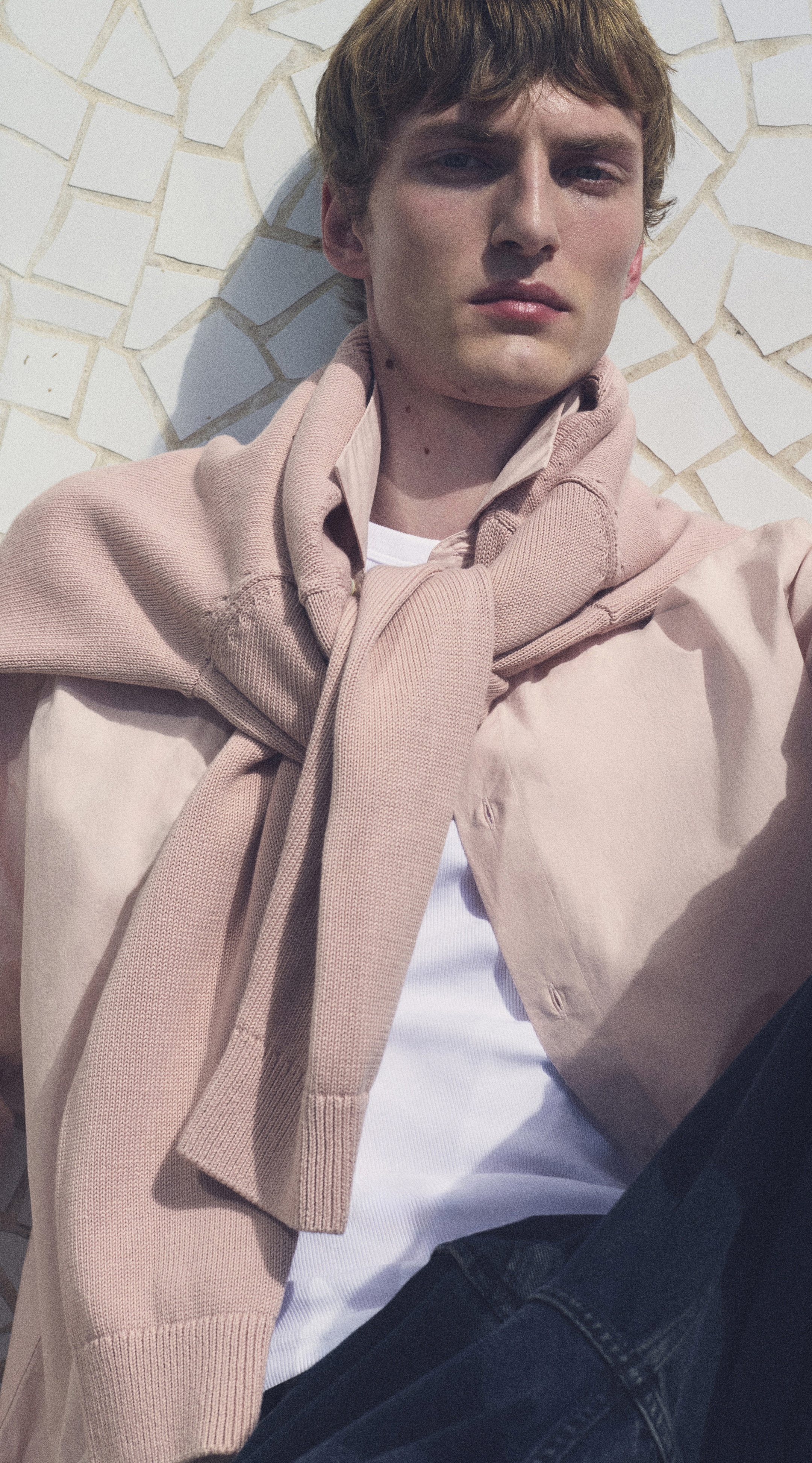 Man in a pink shirt and a pink jumper