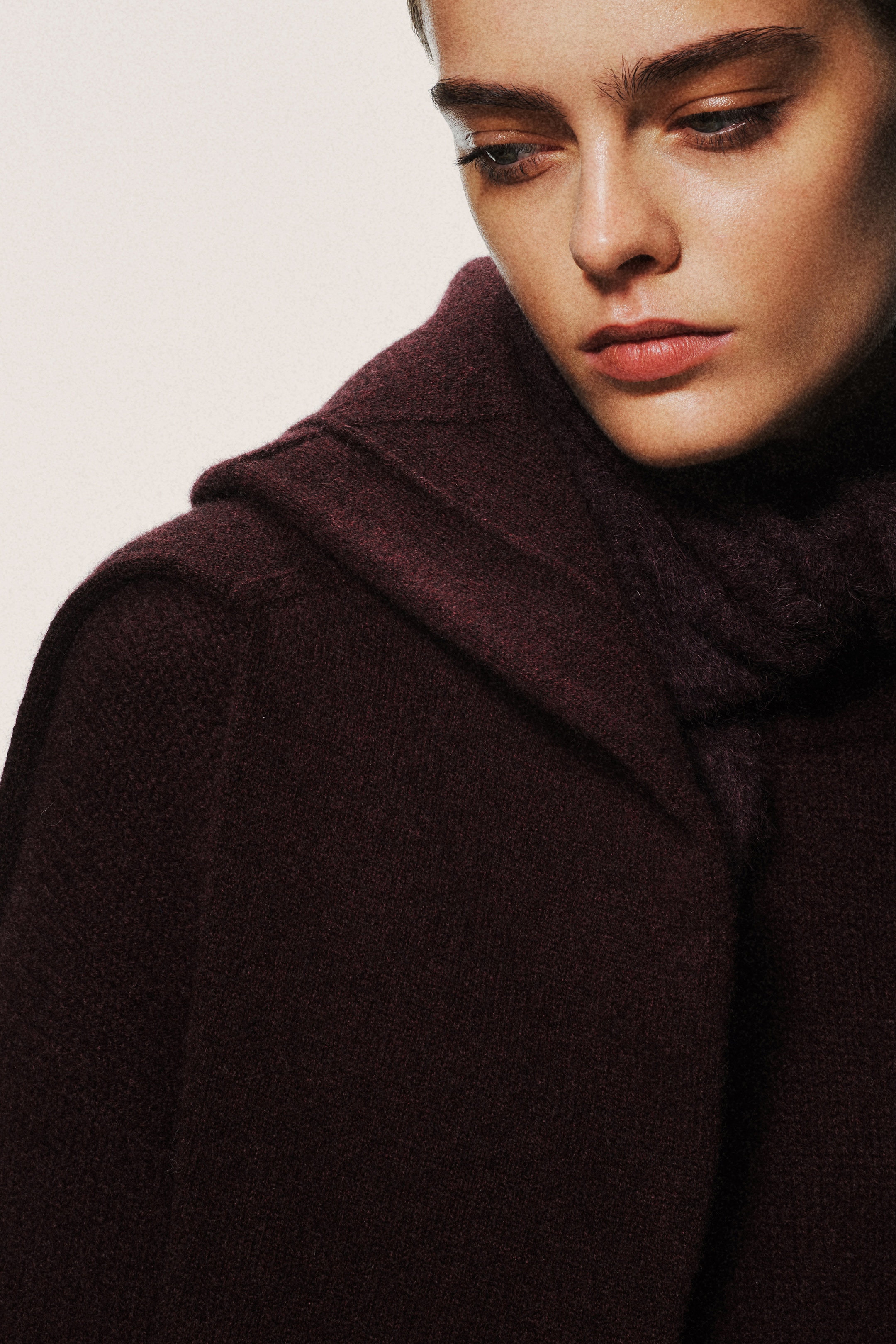 woman in burgundy scarf