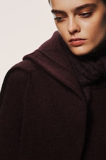 Placeholder for: woman in burgundy scarf