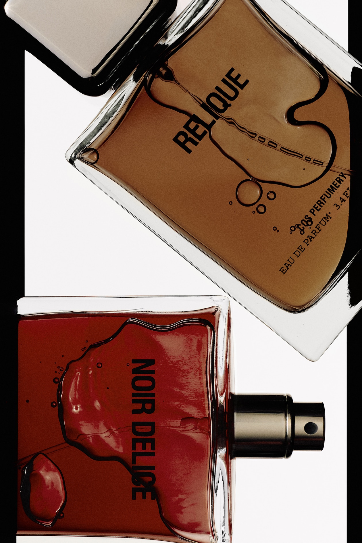 Two perfume bottles, one labeled "RELIQUE" with amber liquid and the other "NOIR DELICE" with dark red liquid, positioned diagonally.