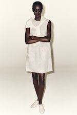 Placeholder for: Person wearing white linen dress