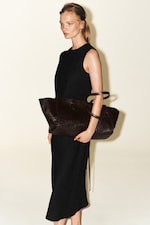 Placeholder for: Person wearing black linen dress