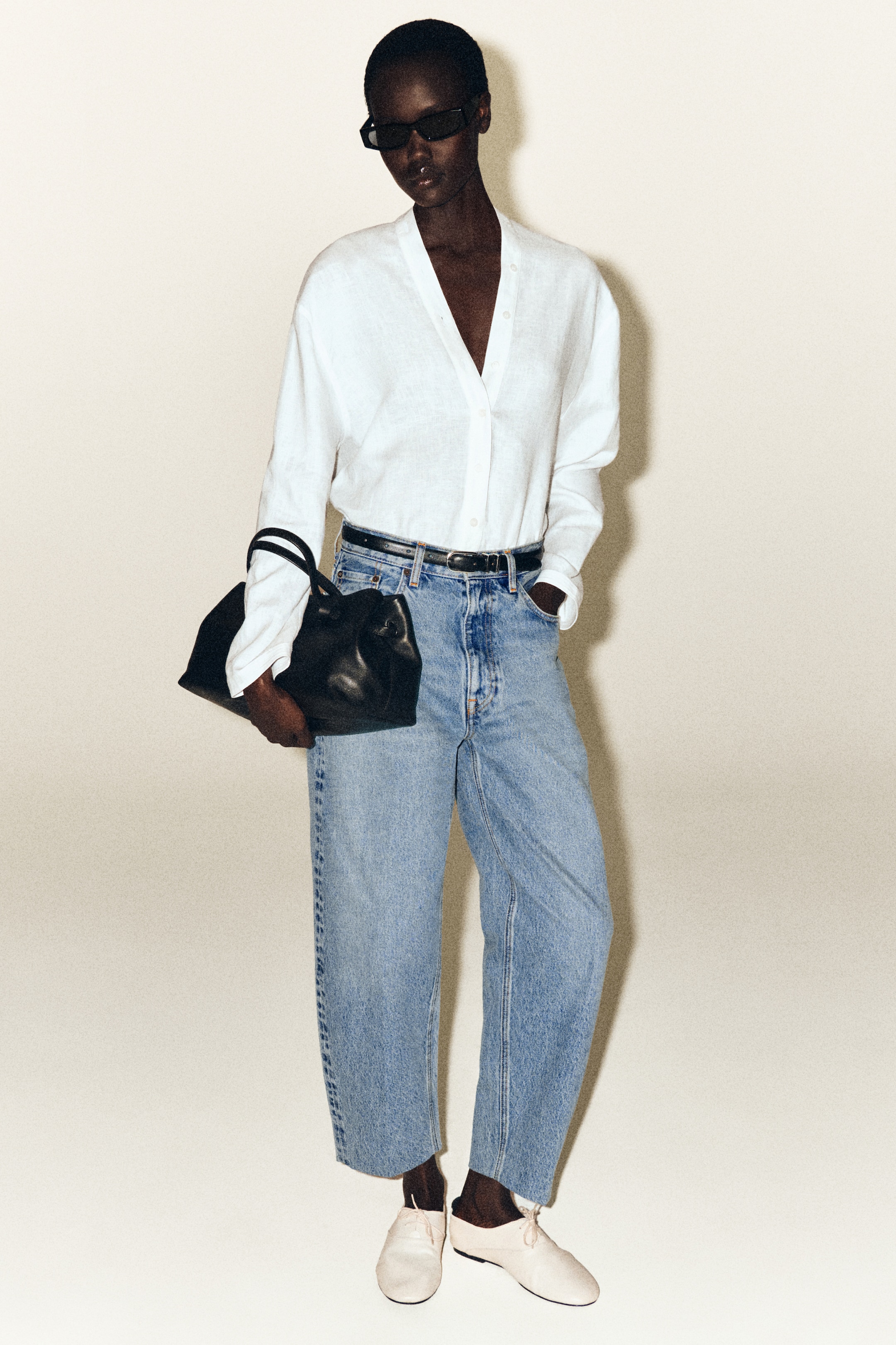 Person wearing white linen shirt