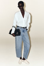Placeholder for: Person wearing white linen shirt