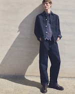 Placeholder for: Man in a denim jacket and check shirt