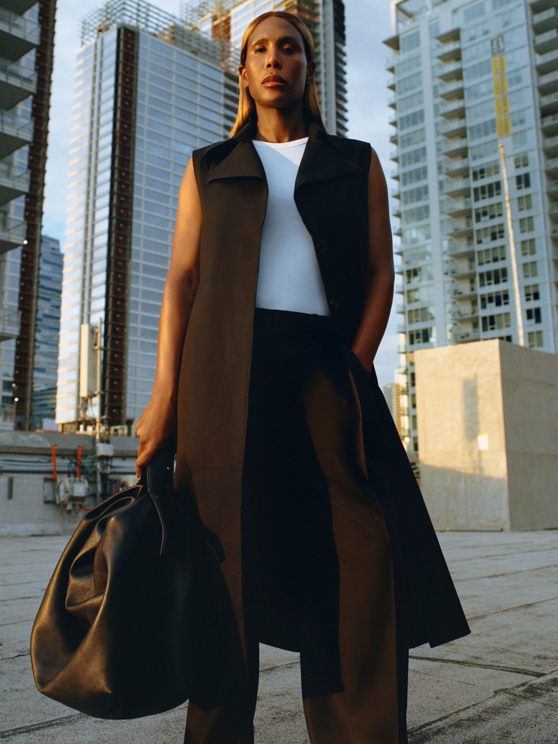 Honey wears gilet, vest, trousers, and bag by COS.