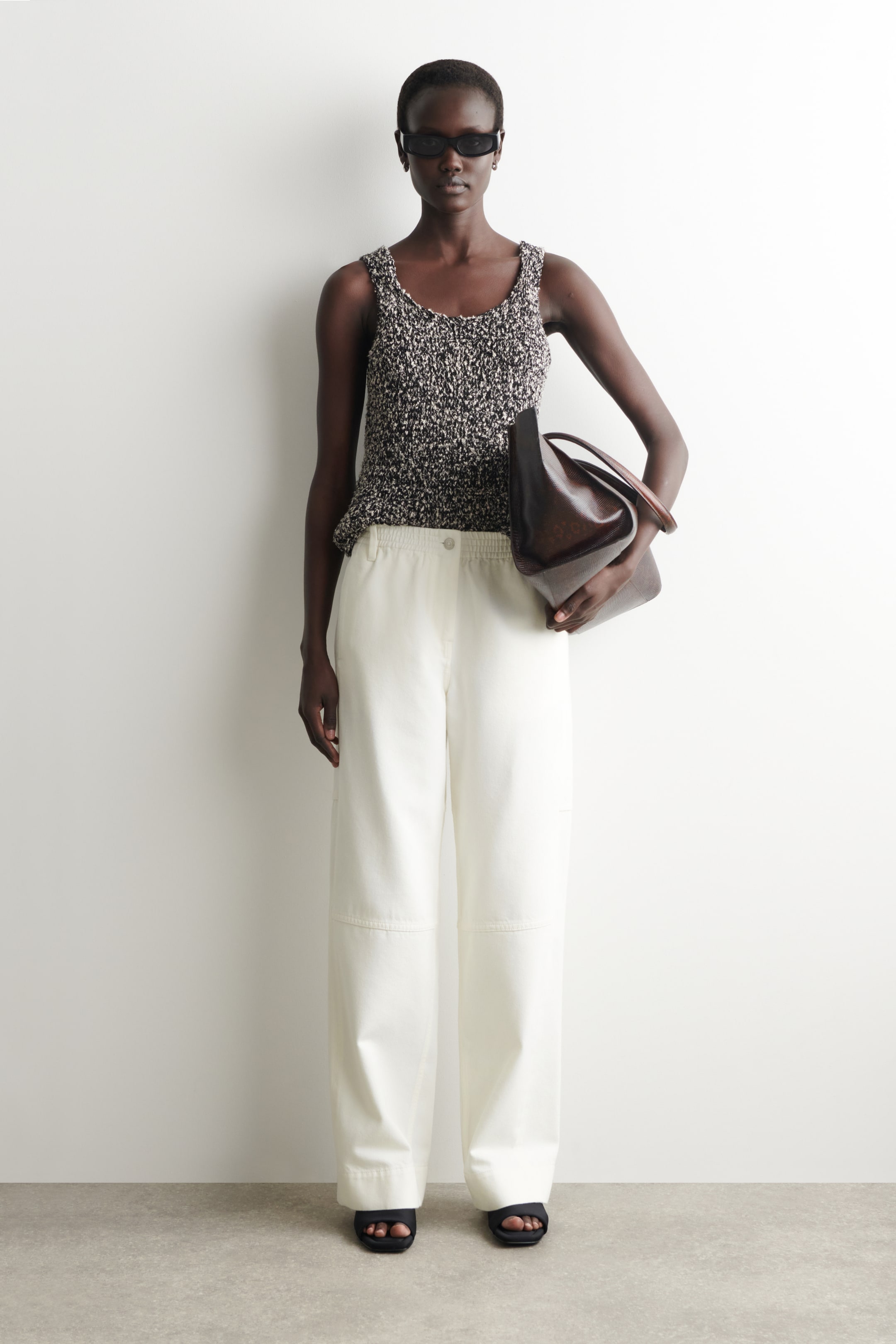 Woman in white wide leg jeans