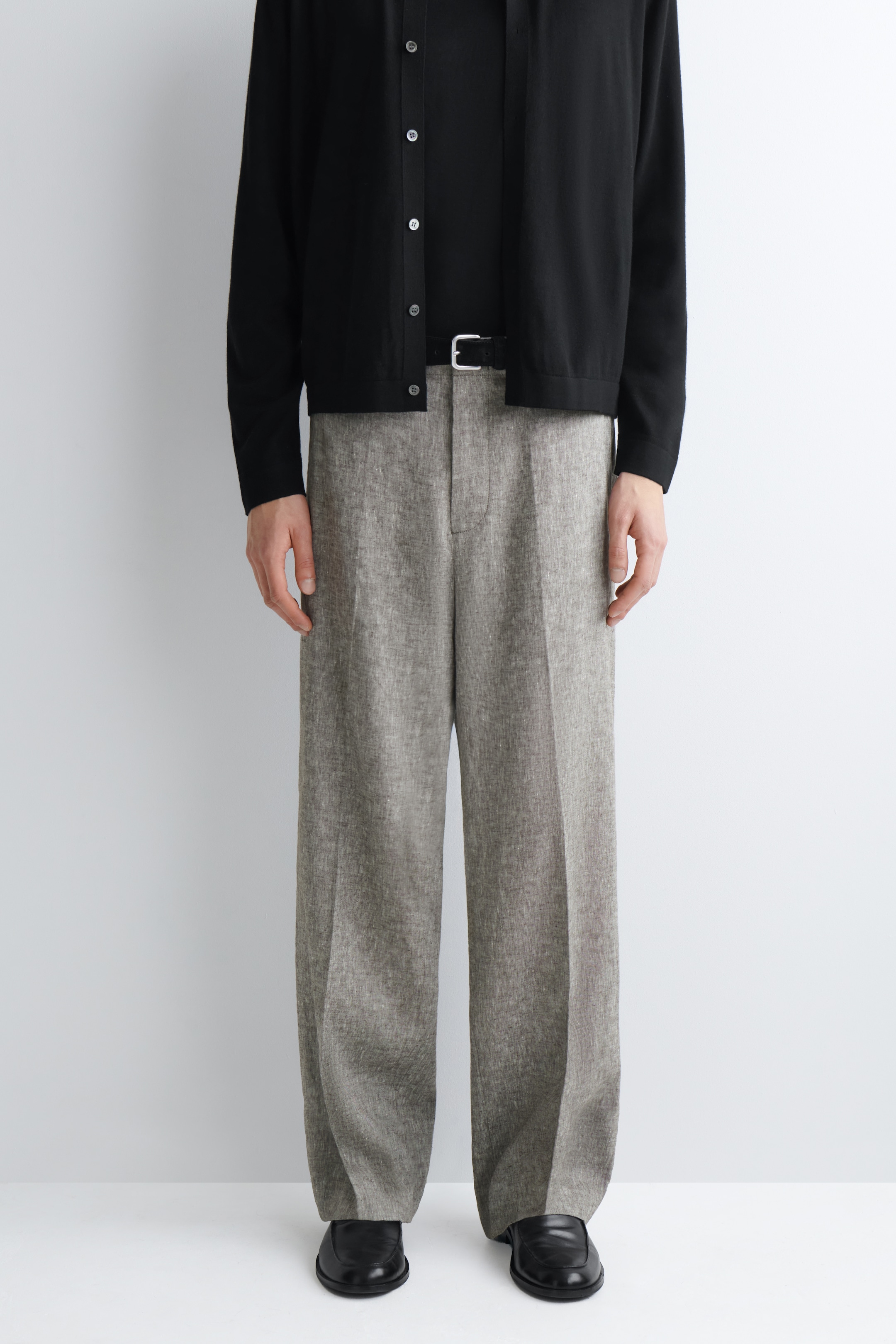 cropped image of man in linen straight leg trousers