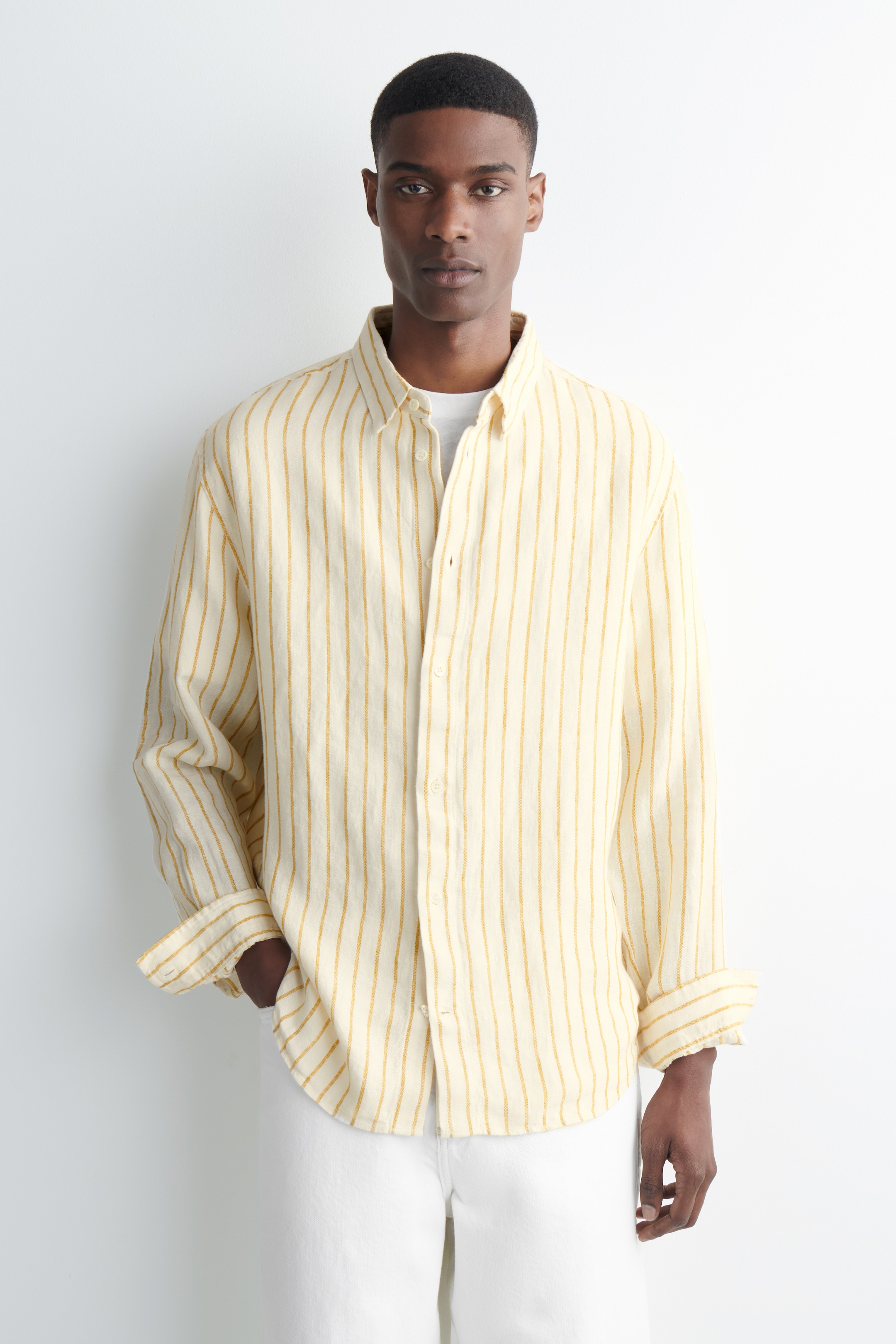 man in yellow stripe shirt