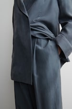 Placeholder for: close up on silk trousers