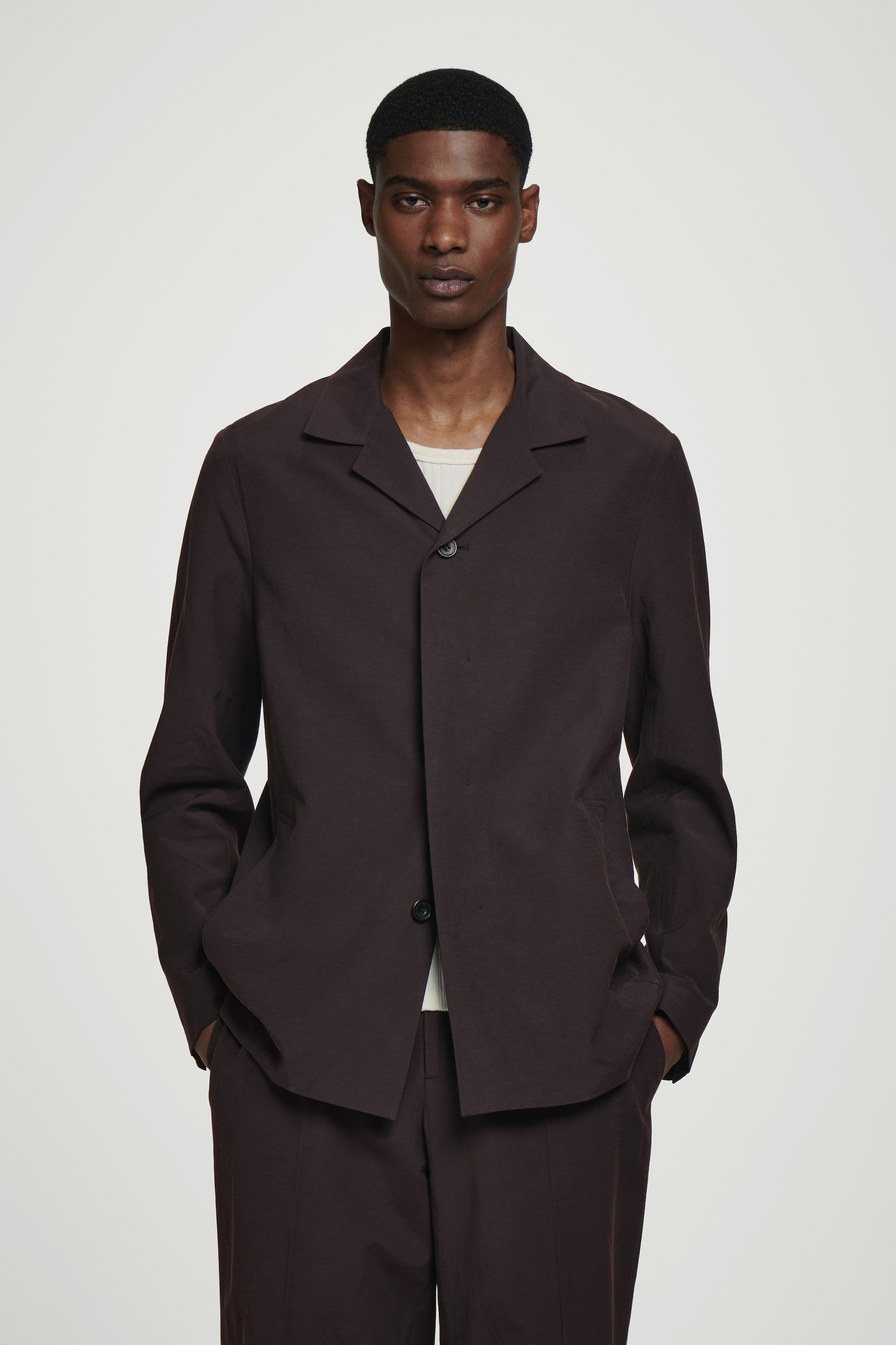 Person wearing brown