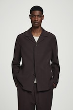 Placeholder for: Person wearing brown