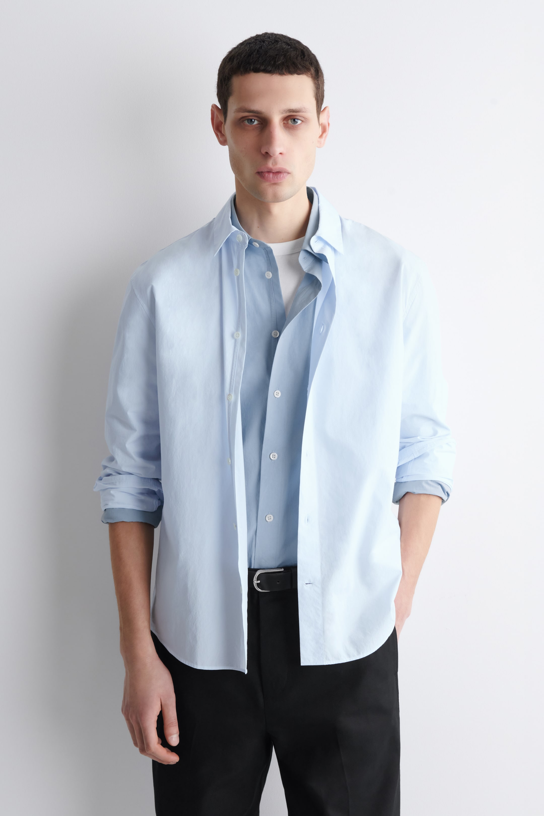 man in blue cotton shirt long sleeve