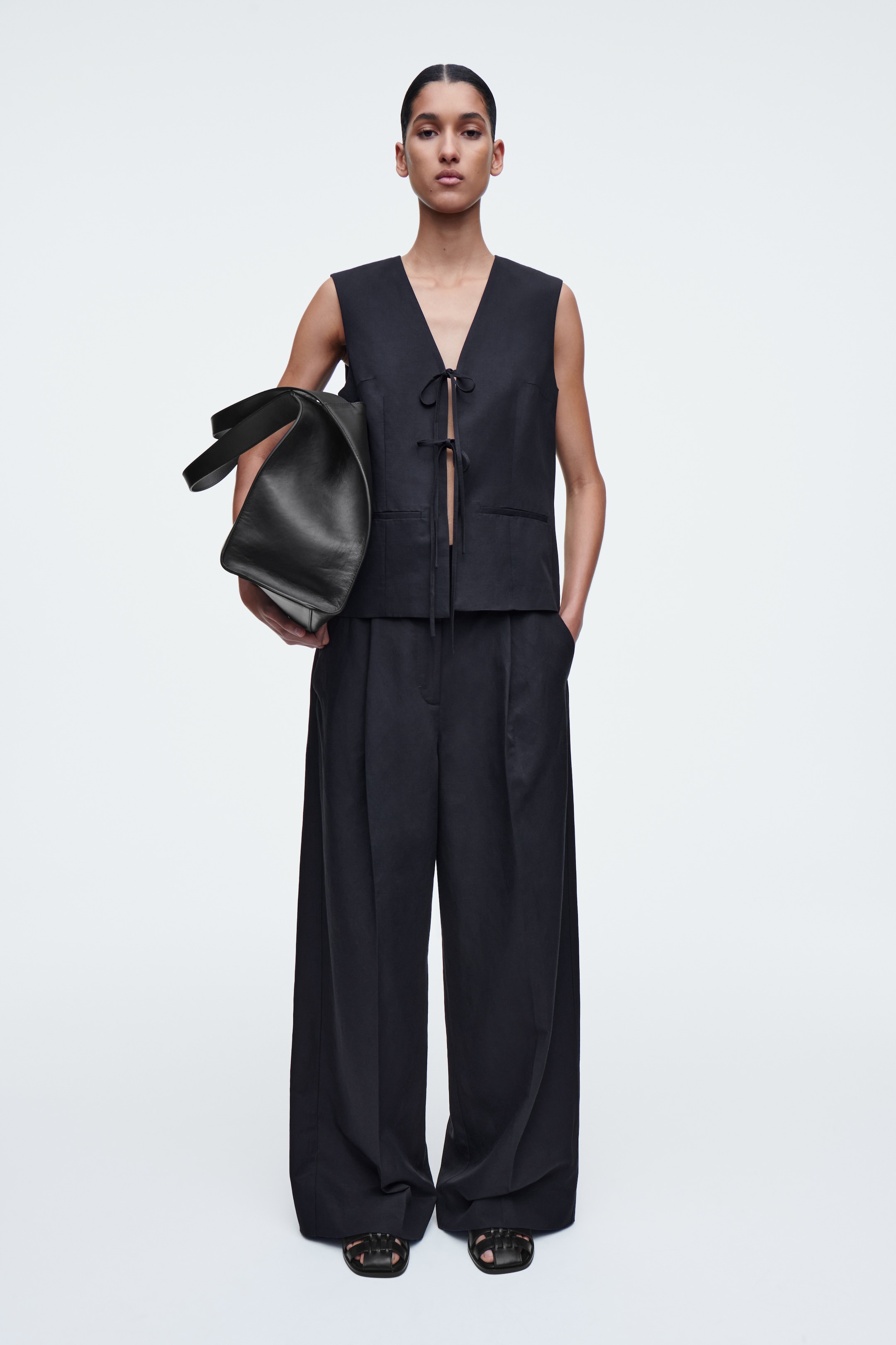 person wearing black trousers