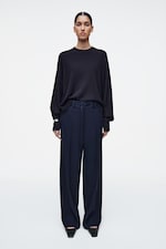 Placeholder for: person wearing blue trousers