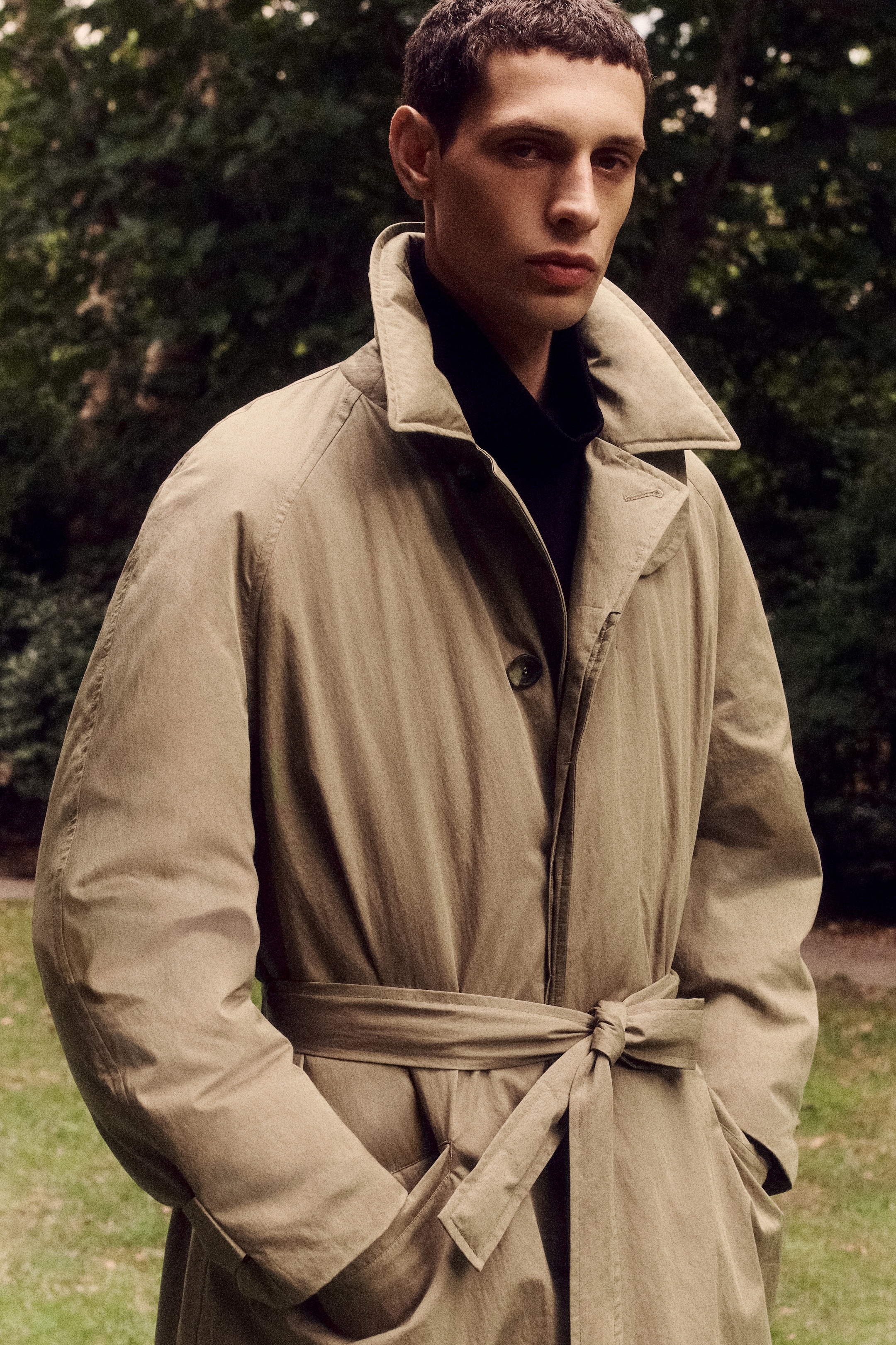 man in trench style puffer
